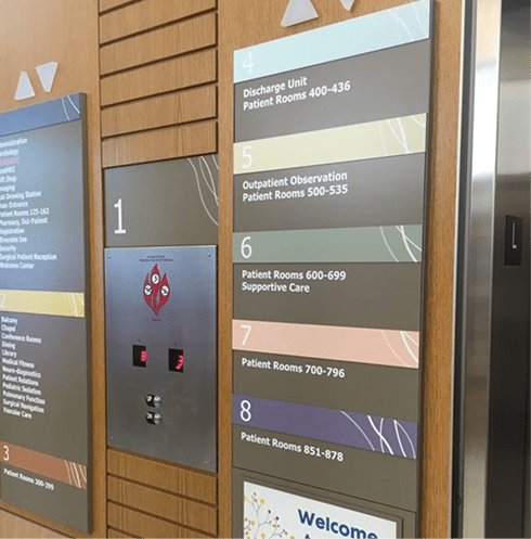 closeup of elevators with wayfinding signage system